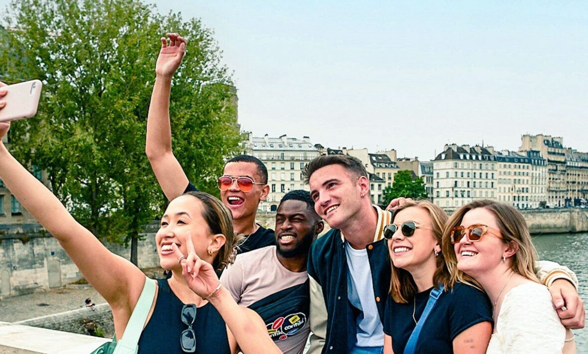 Six young friends taking a group photo.
