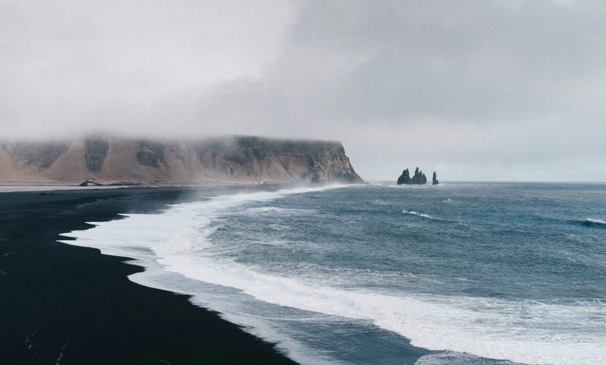 black sand beach of Iceland with dramatic waves