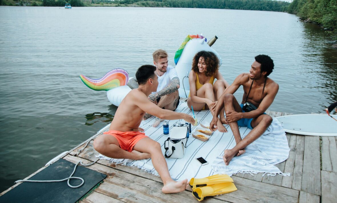 friends laughing on deck on holidays: Pexel: Ron Lach