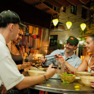 Contiki travellers in Vietnam eating food