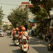 Contiki travellers on the back of vespas in Vietnam