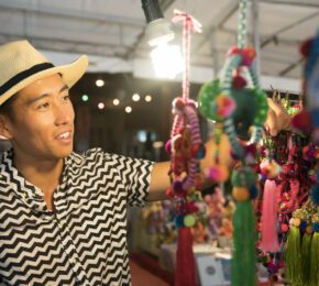 Man shopping for souvenirs in Asia