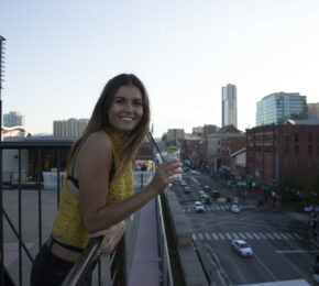 girl leaning on balcony