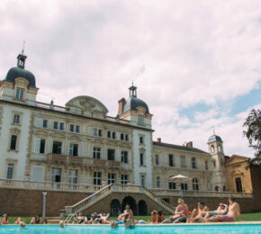 A Contiki Special Stays with a pool in front of it.