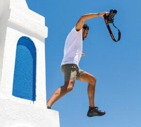 A travel addict soaring over a bell.