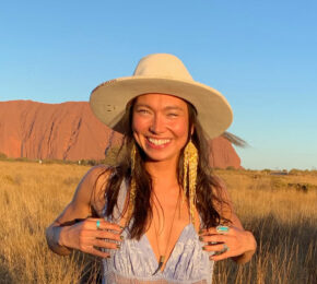 Sarain Fox posing in front of Uluru.