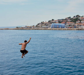 Boy jumping into Croatian sea