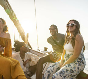 A group of people on a Contiki boat trip in the ocean.