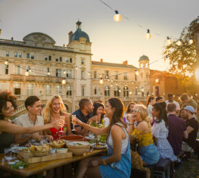 Contiki Chateau, group of friends eating and drinking at dusk