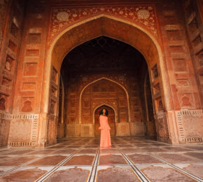 A woman in an ornate building.