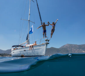 Corfu Greece jumping in ocean off boat