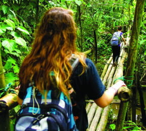 Girl-walking-over-bridge-volunteering