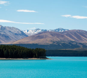 A serene lake surrounded by majestic mountains in Covid-19 free New Zealand.