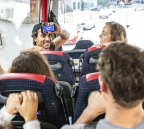 A group of people on a bus traveling.