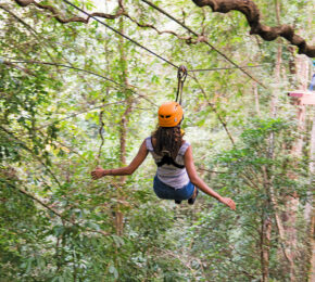 A woman on a zip line in Thailand.