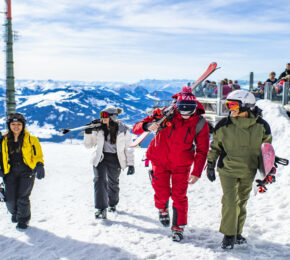 group of happy skiers in hopfgarten, austria