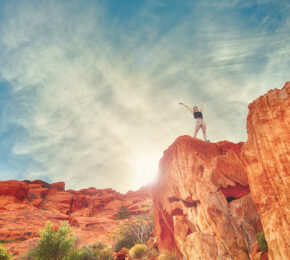 sustainability - image of a girl standing on a rock