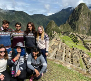 Group of friends on Peru Panorama at Machu Picchu