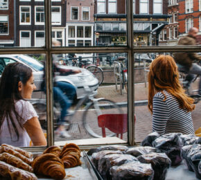 travel photography - girls outside cafe in amsterdam