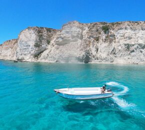 boat off the white shores of Crete, Greece