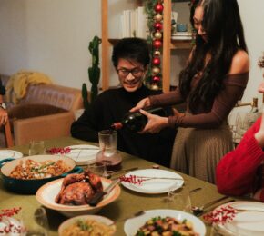 friends enjoying Thanksgiving feast together