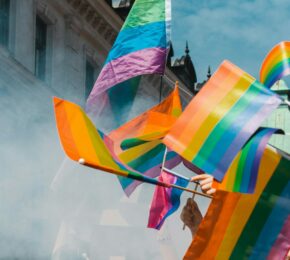 waving flags at a Pride festival