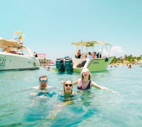 Playa del Carmen, Mexico - travellers swimming in clear waters