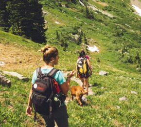 two girls hiking together in the mountains