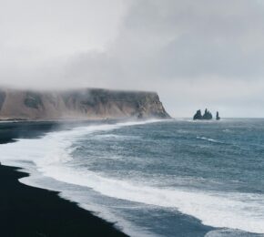 black sand beach of Iceland with dramatic waves