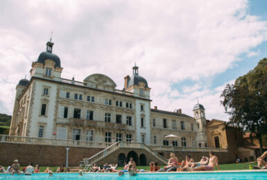 A Contiki Special Stays with a pool in front of it.