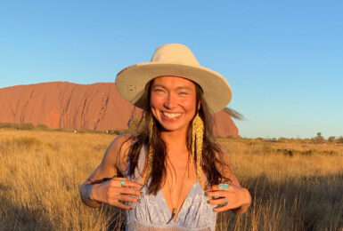 Sarain Fox posing in front of Uluru.