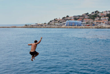 Boy jumping into Croatian sea