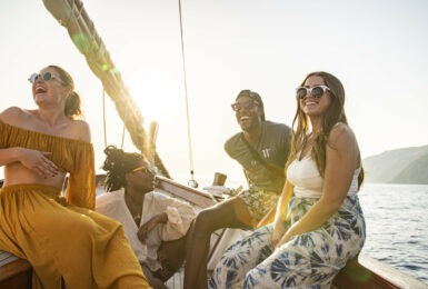 A group of people on a Contiki boat trip in the ocean.