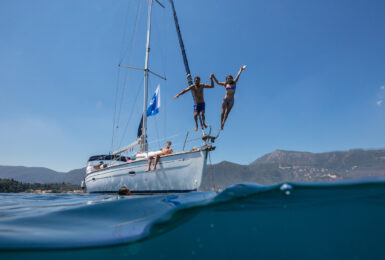 Corfu Greece jumping in ocean off boat