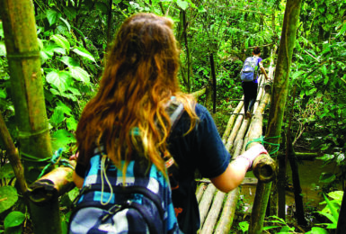 Girl-walking-over-bridge-volunteering