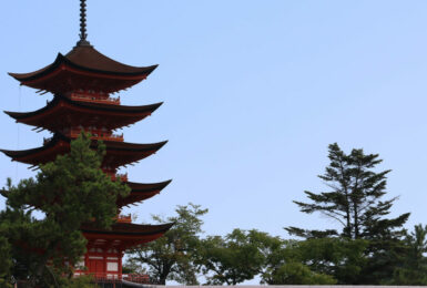 A pagoda tower in a park captured in travel videos.