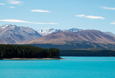 A serene lake surrounded by majestic mountains in Covid-19 free New Zealand.