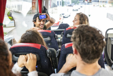 A group of people on a bus traveling.