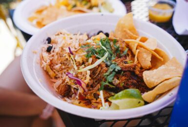 A bowl of Mexican food, known for being the best in Costa Rica, sitting on a table.