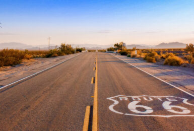 An empty road with a LA sign painted on it.