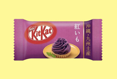 A Japanese kitkat bar on a yellow background.