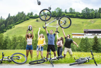 A group of people posing with their bicycles, showcasing things to do in Austria.