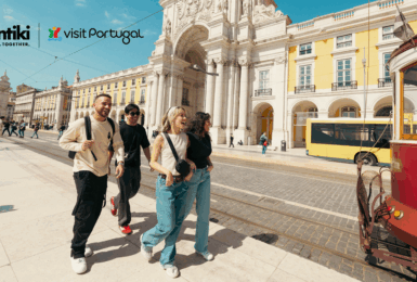 Group of young people walking down a street in Portugal in a Visit Portugal ad.
