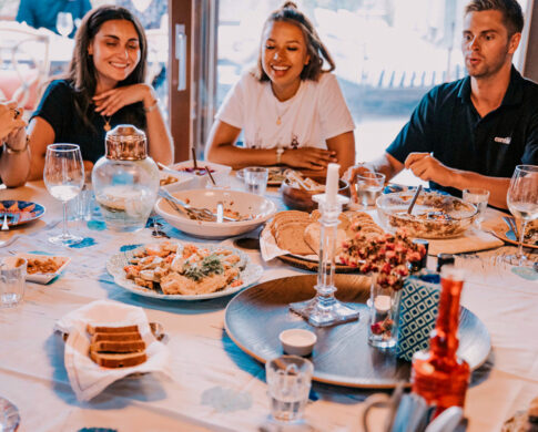 Friends eating together, Portugal