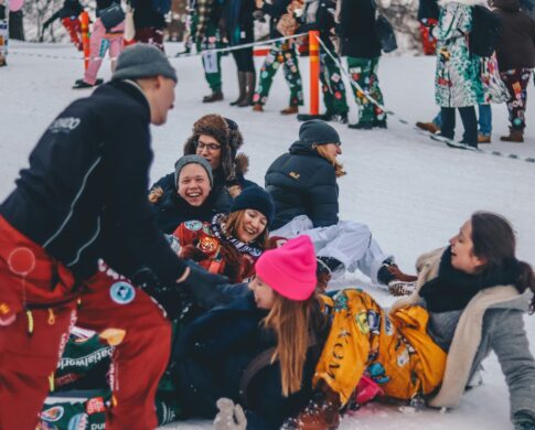 people laughing together in snow in Finland