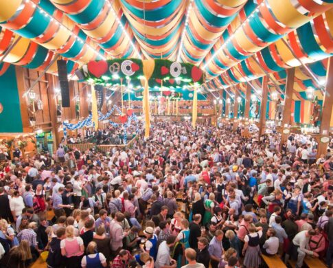 Crowds gathering in Schützen Festzelt at Oktoberfest in Munich