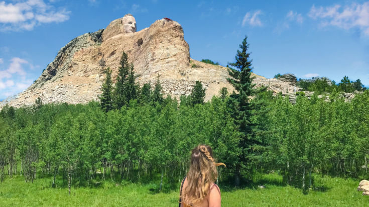 Girl looking at Crazy Horse Memorial mountain carving