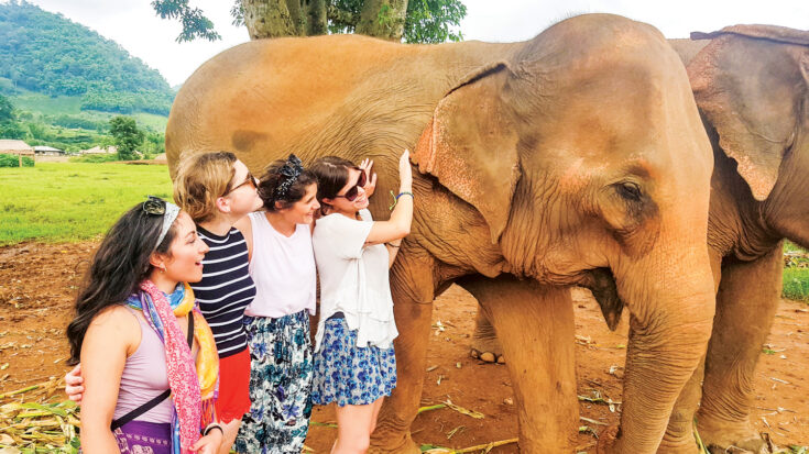 Women, elephant