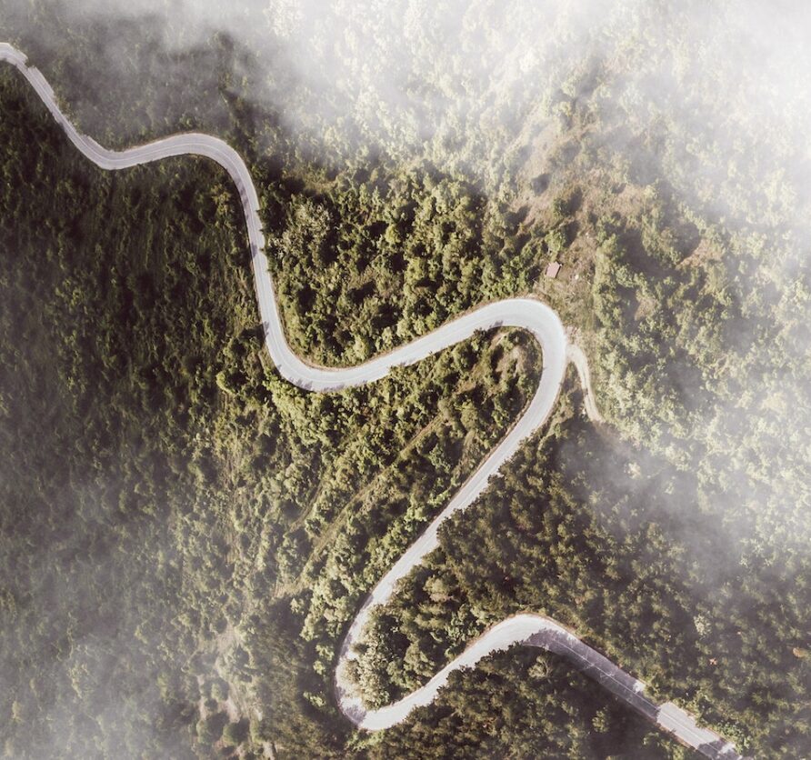 Aerial view of a winding mountain road.