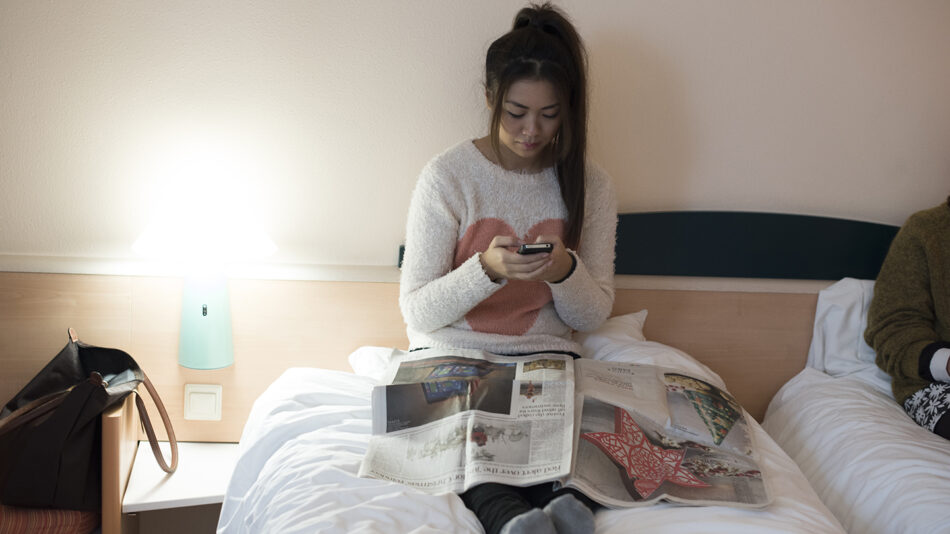 girl-on-her-phone-in-bed